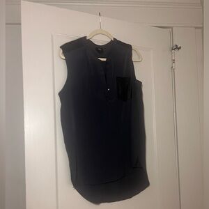 Beautiful blouse with faux leather like detailed pocket.